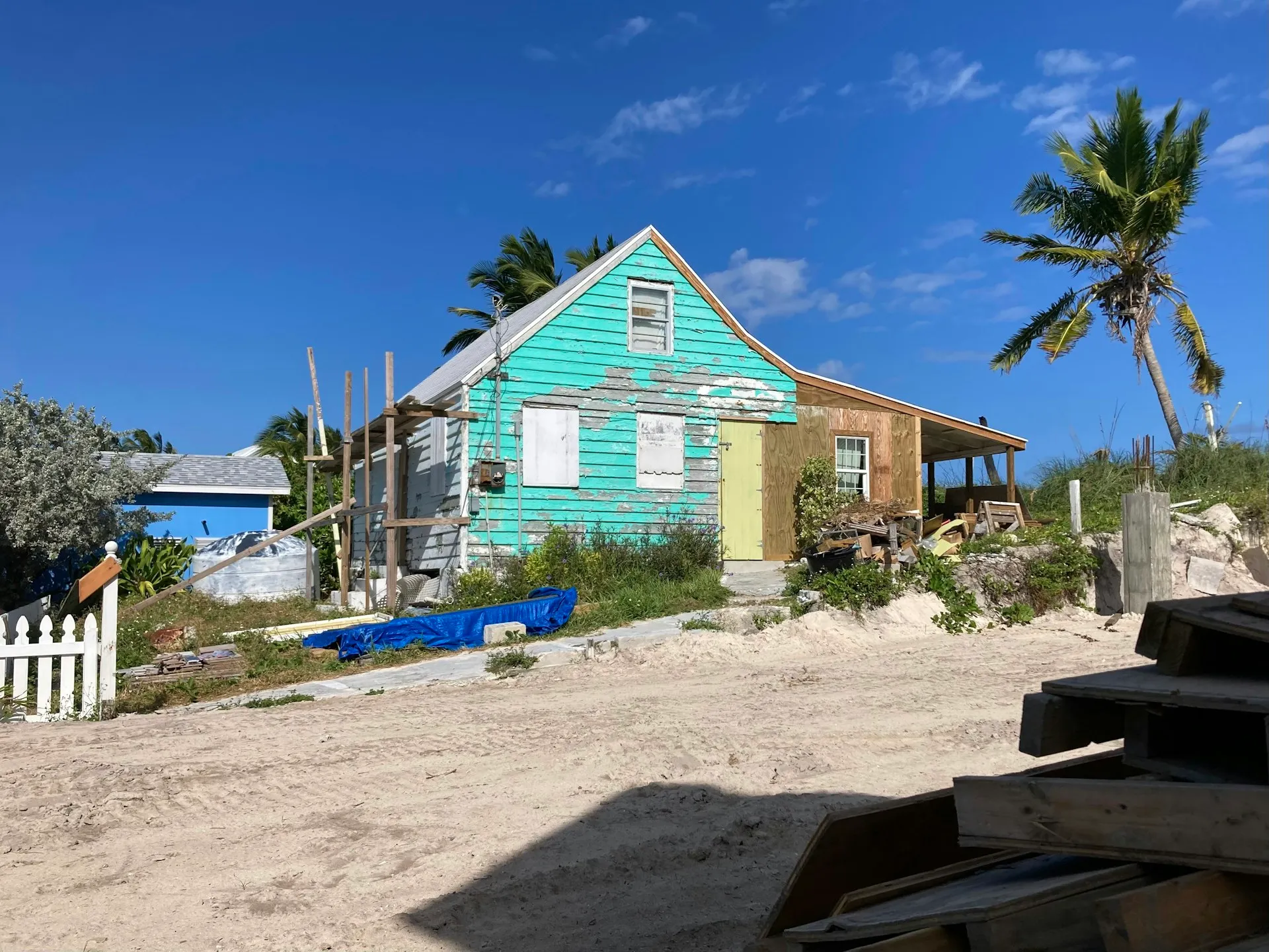 Pastel colonial cottage on a sandy beach in the Abacos, Bahamas