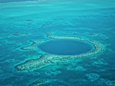 Aerial view of a blue hole in the ocean