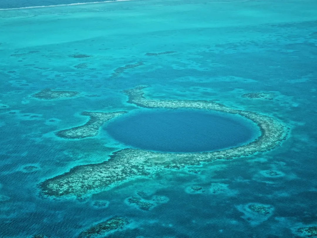 Aerial view of a blue hole in the ocean